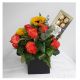 Box with roses, sunflowers and chocolates