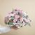 Funeral centrepiece in pink tones