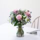 Bouquet of roses and mixed flowers with decorative greenery